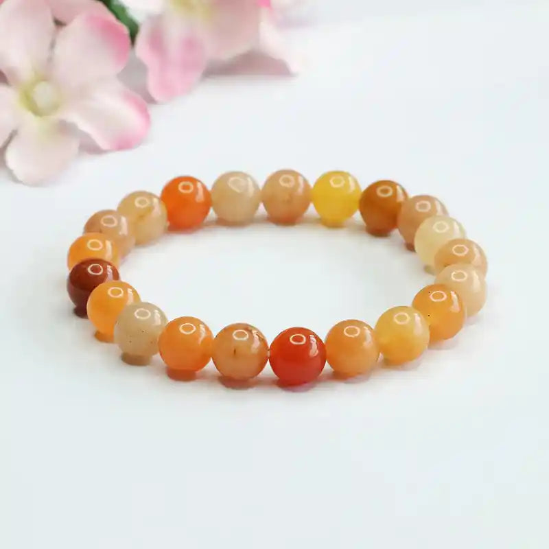 Colorful bracelet with gold and jade round beads